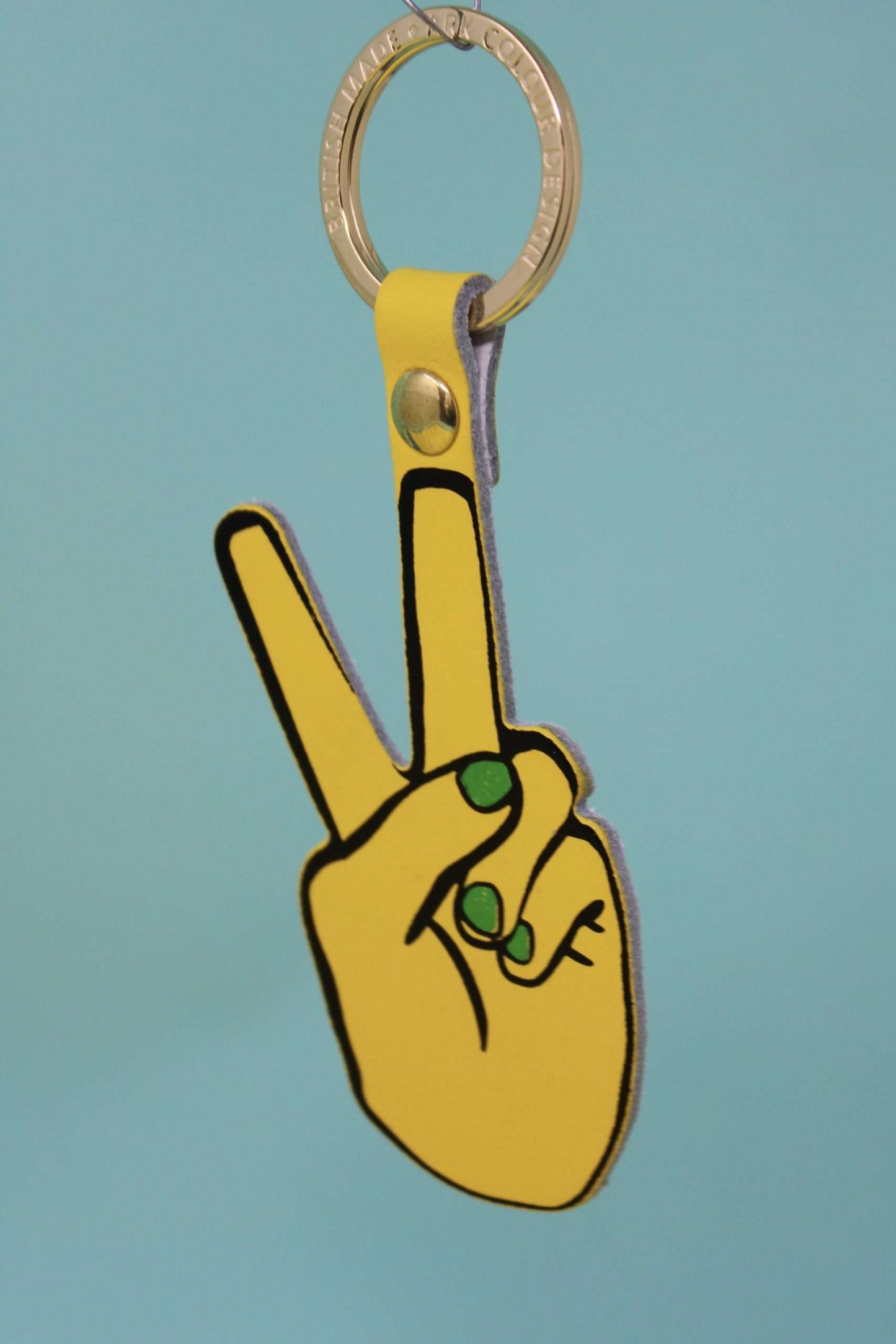 Genuine Leather Hand Peace Sign Keyring by Ark Colour Design. Yellow hand with green shimmery nails on a gold plated key fob.